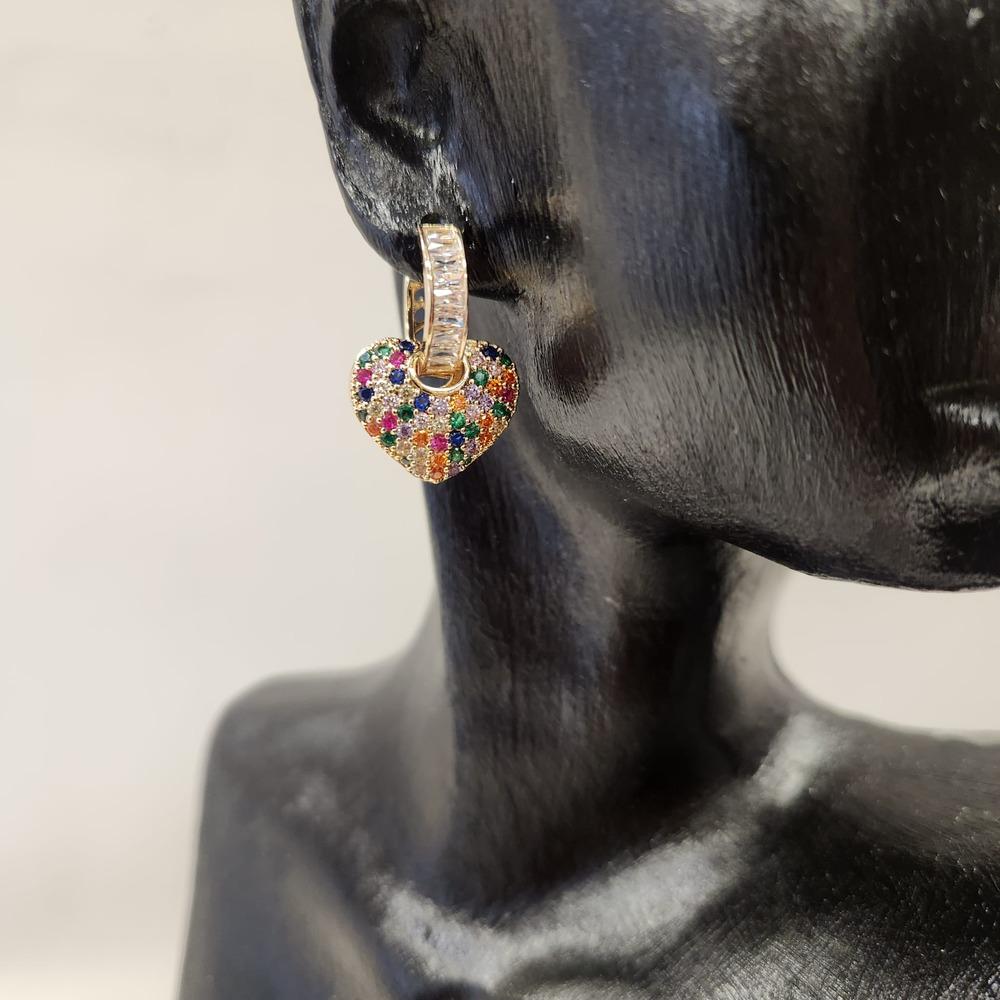 Detailed view of Dangle heart shaped earrings with clear and colorful stones
