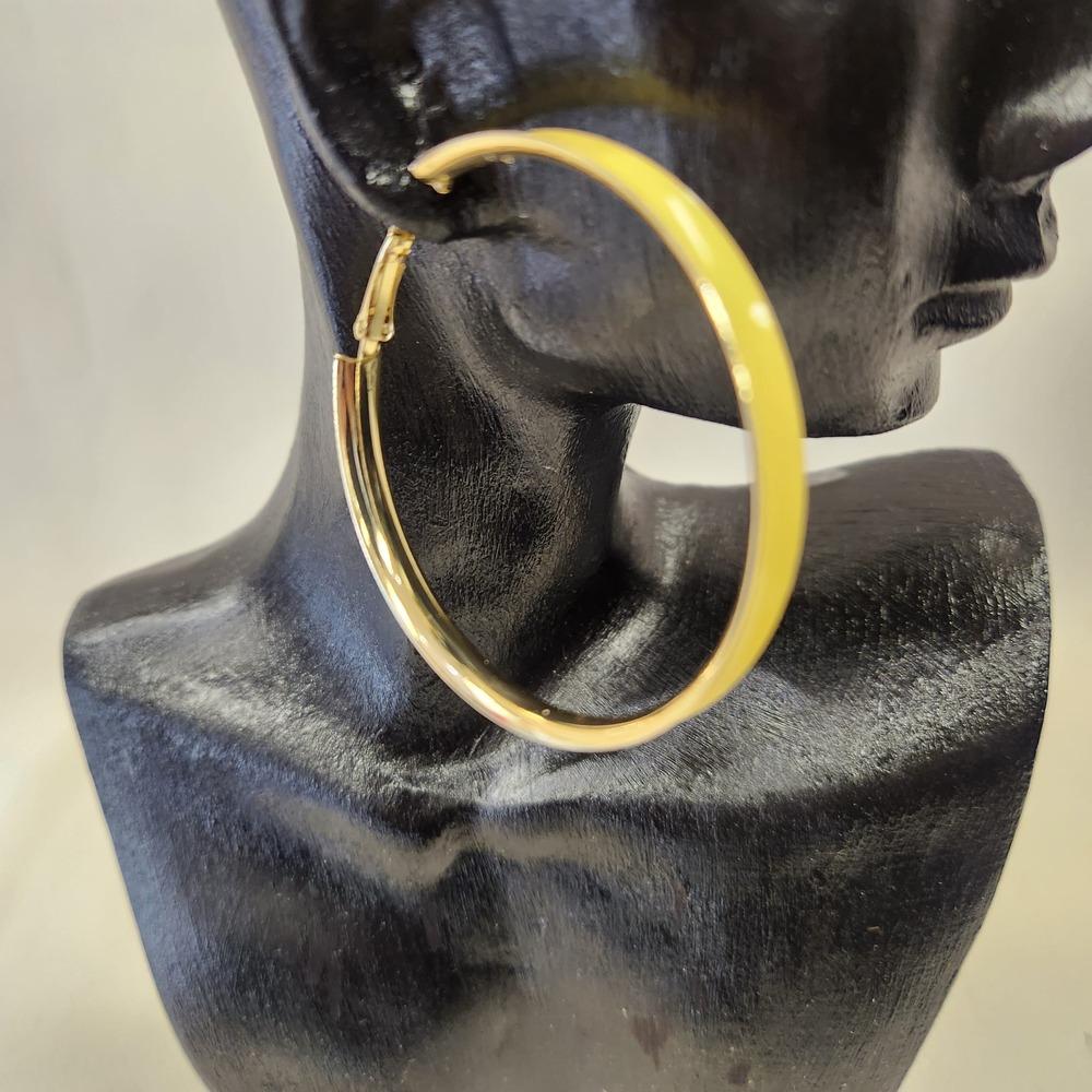 Detailed view of Large hoop earrings with yellow enamel coating