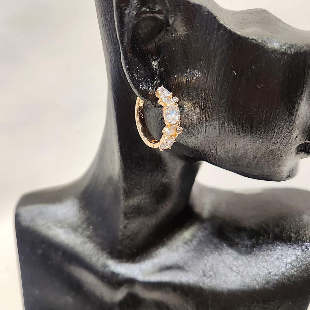 Detailed side view of Small hoop earrings with multi cut stones