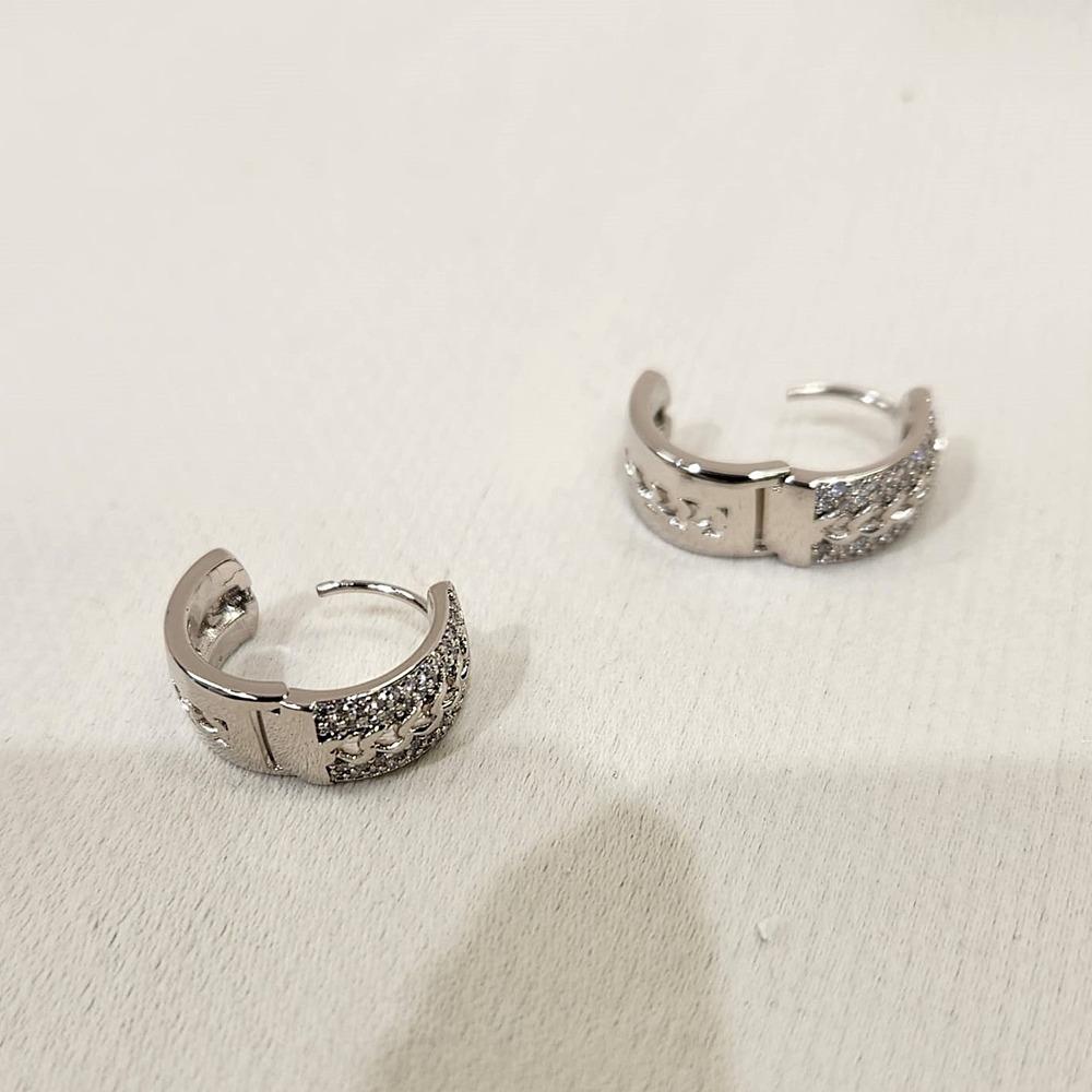 Latch back post of Small hoop silver hued earrings