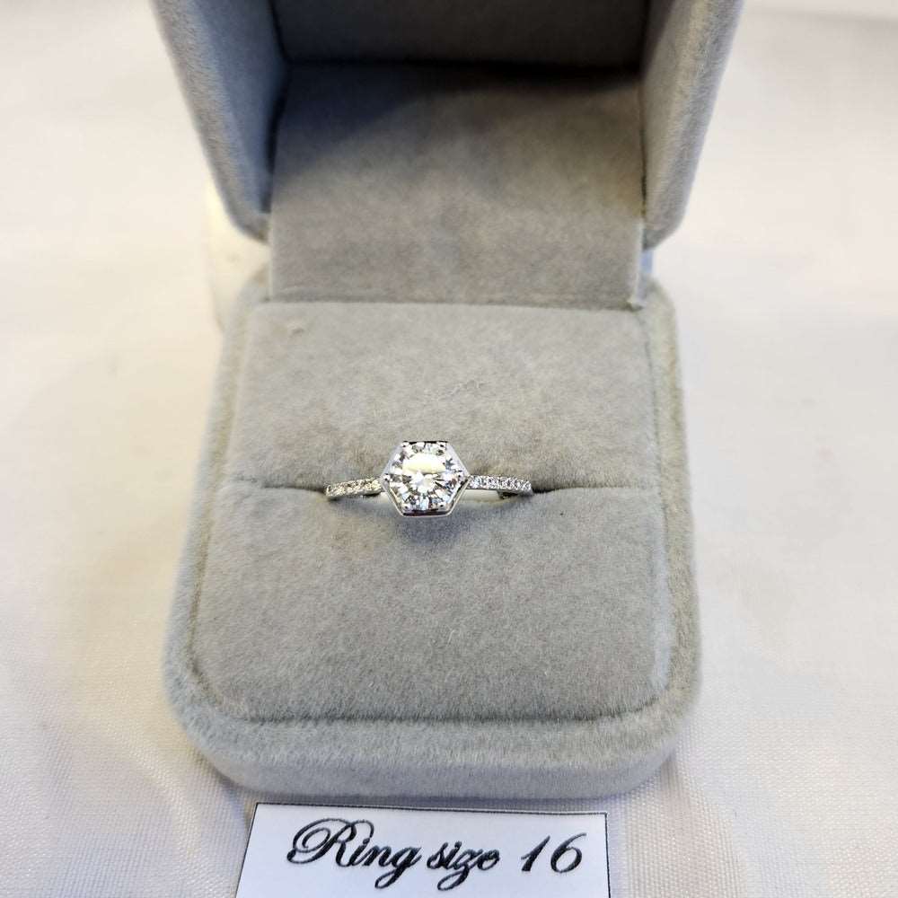 Delicate bezel set silver frame ring
