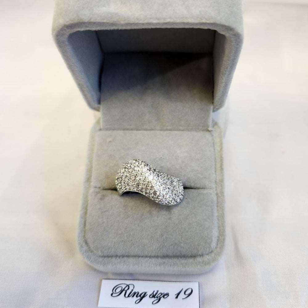 Curved ribbon shaped stone studded ring