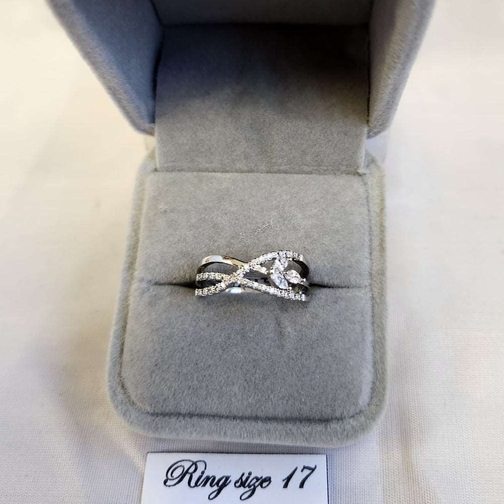 Delicate silver color ring with round and marquise stones