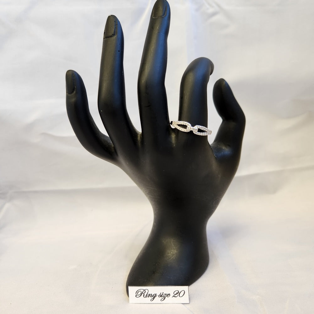 Dainty link chain design ring displayed on a mannequin stand