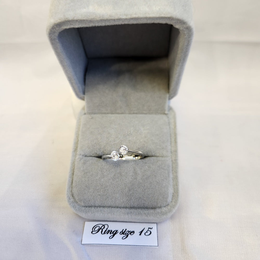 Delicate silver frame ring with clear stones