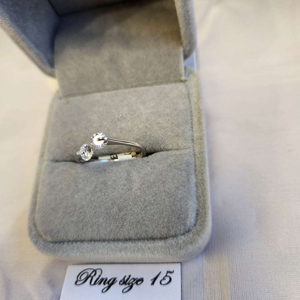 Detailed view of Delicate silver frame ring with clear stones