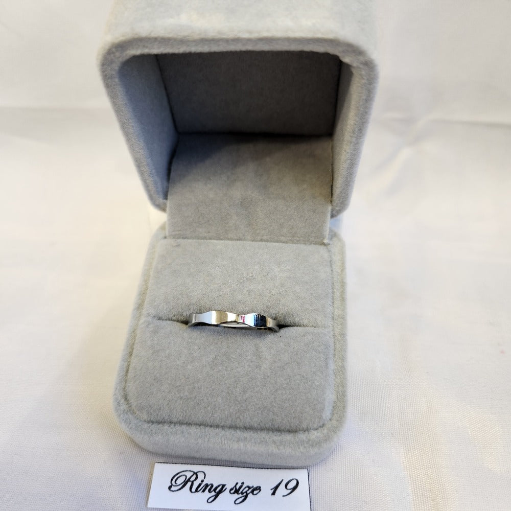Silver colored wave band ring