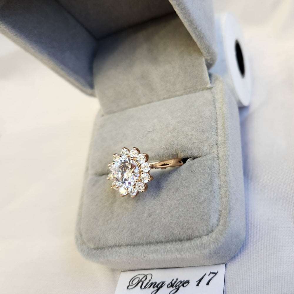 Detailed view of Classic halo shaped ring in gold color frame