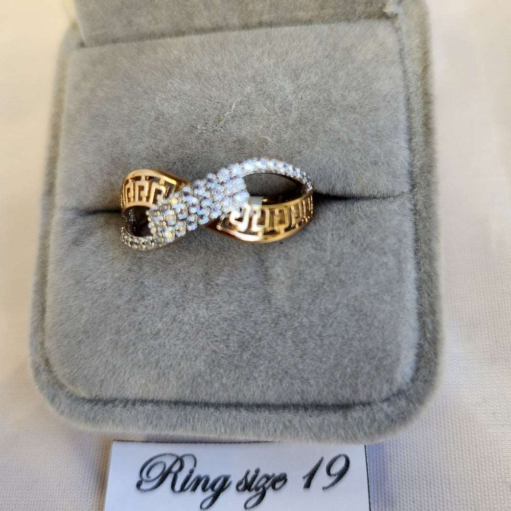 Detailed view of exquisite gold color ring with fine clear stones
