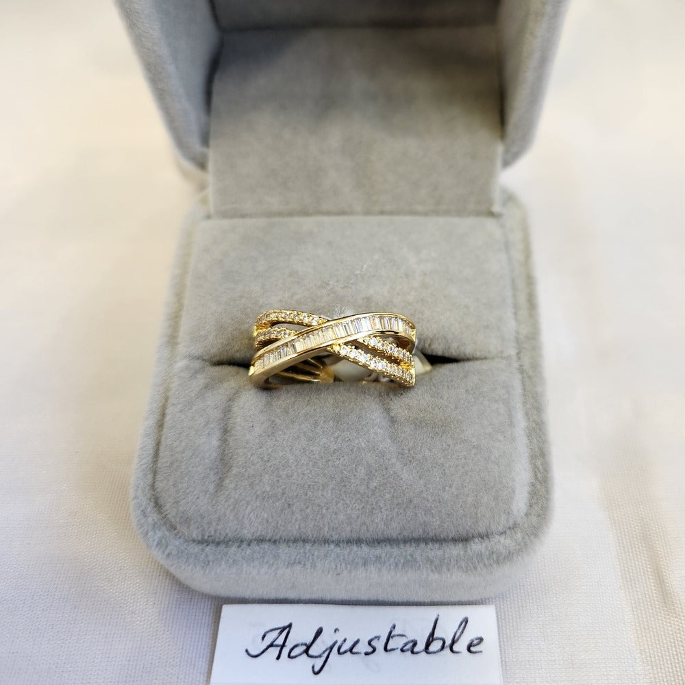Multi strand ring adorned with round and baguette stones