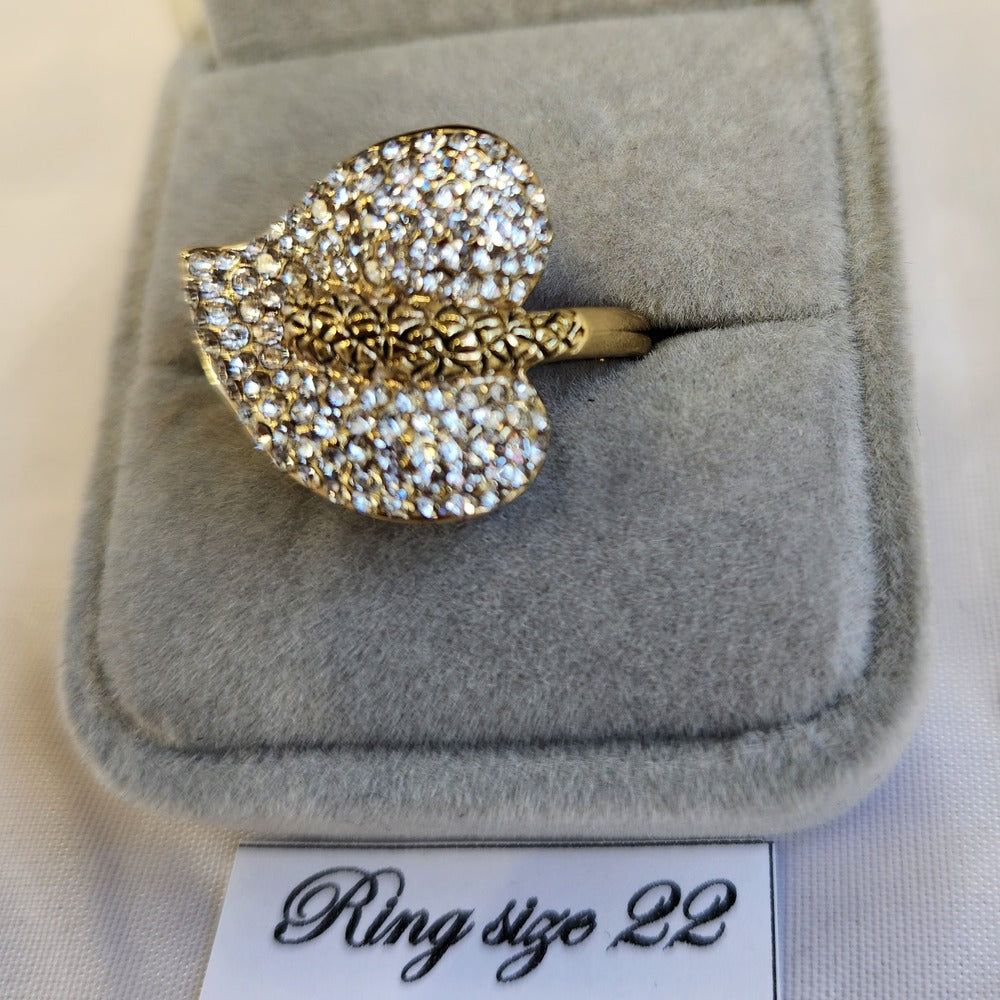Detailed view of nature inspired stone studded gold color ring