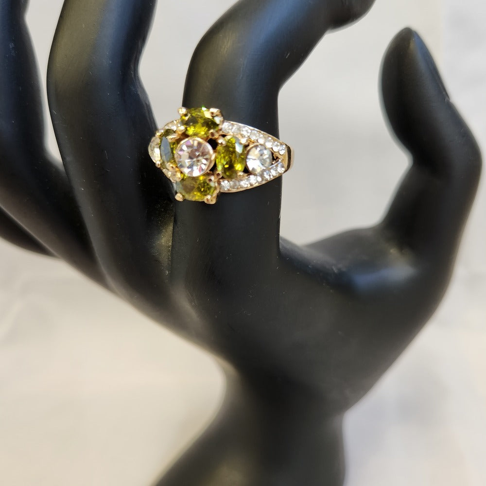 Alternative view of ring with clear and green colored stones