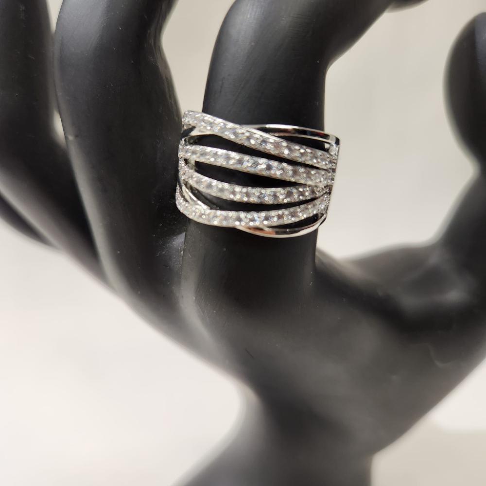 Detailed front view of Silver hued wide band stone studded ring