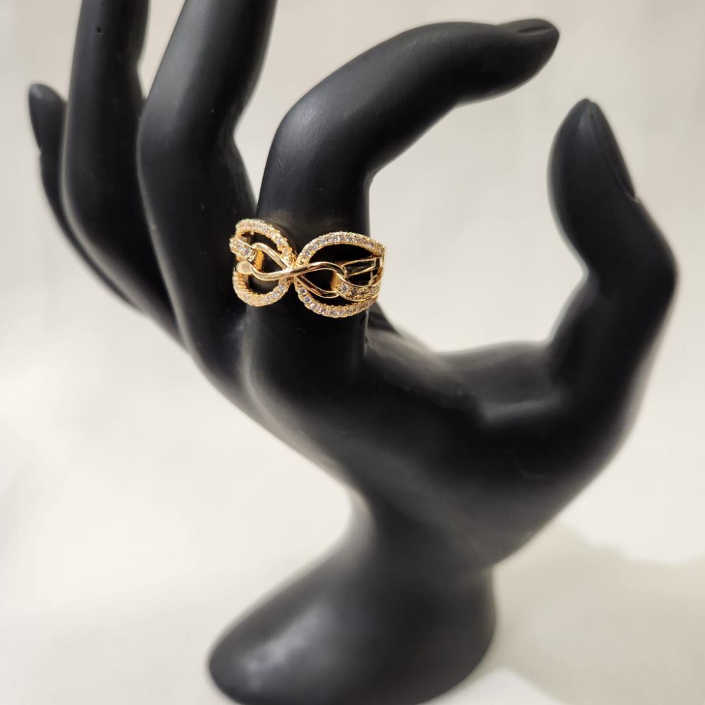 Infinity gold hued ring with cubic zirconia