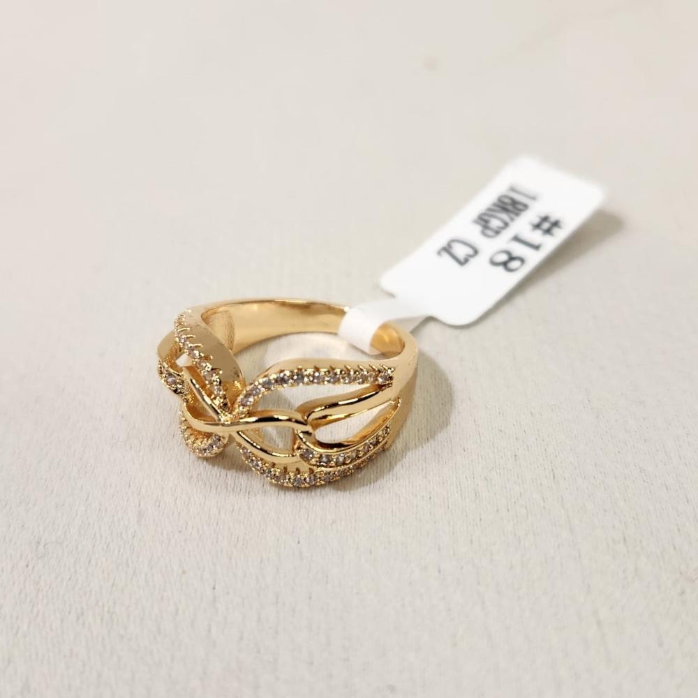 Another view of Infinity gold hued ring with cubic zirconia