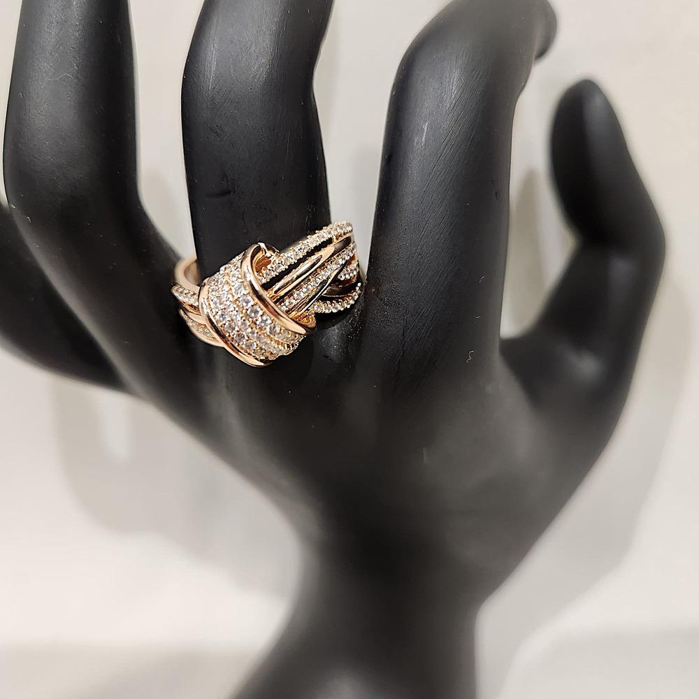 Detailed view of Rose gold knot ring with stones