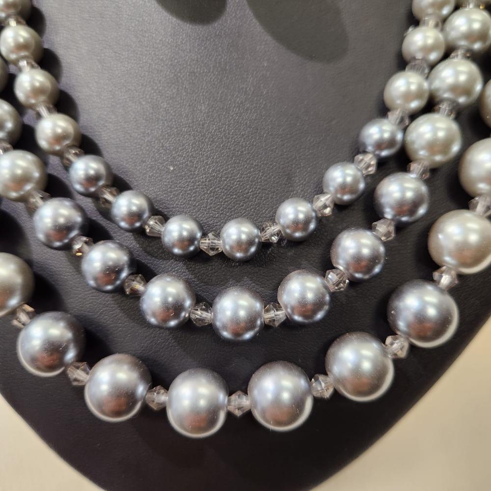 Grey white color graded triple strand pearl necklace