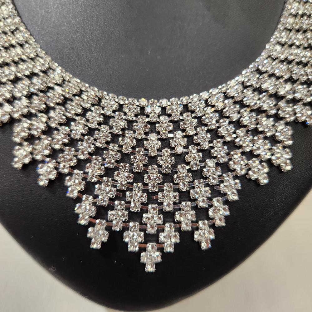 Detailed view of necklace of three piece jewelry set