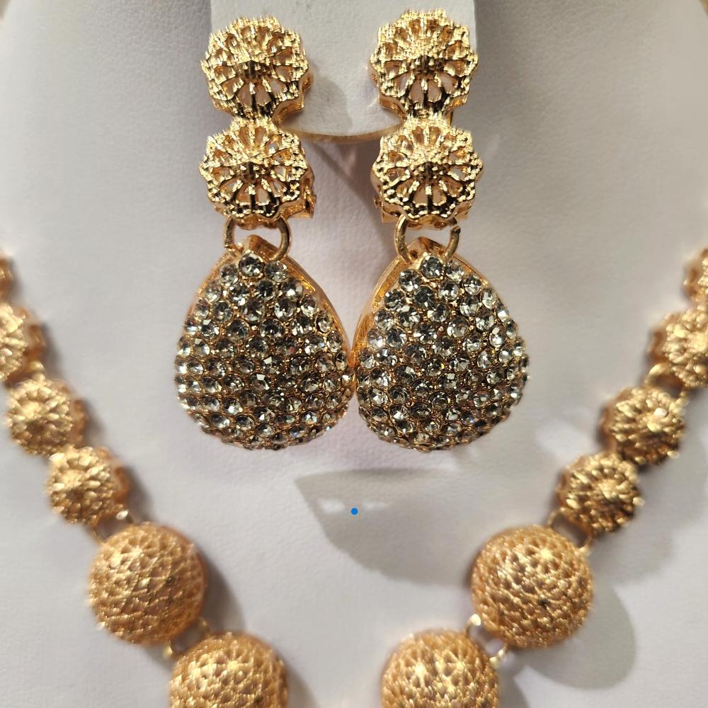 Detailed view of earrings of five piece jewelry set