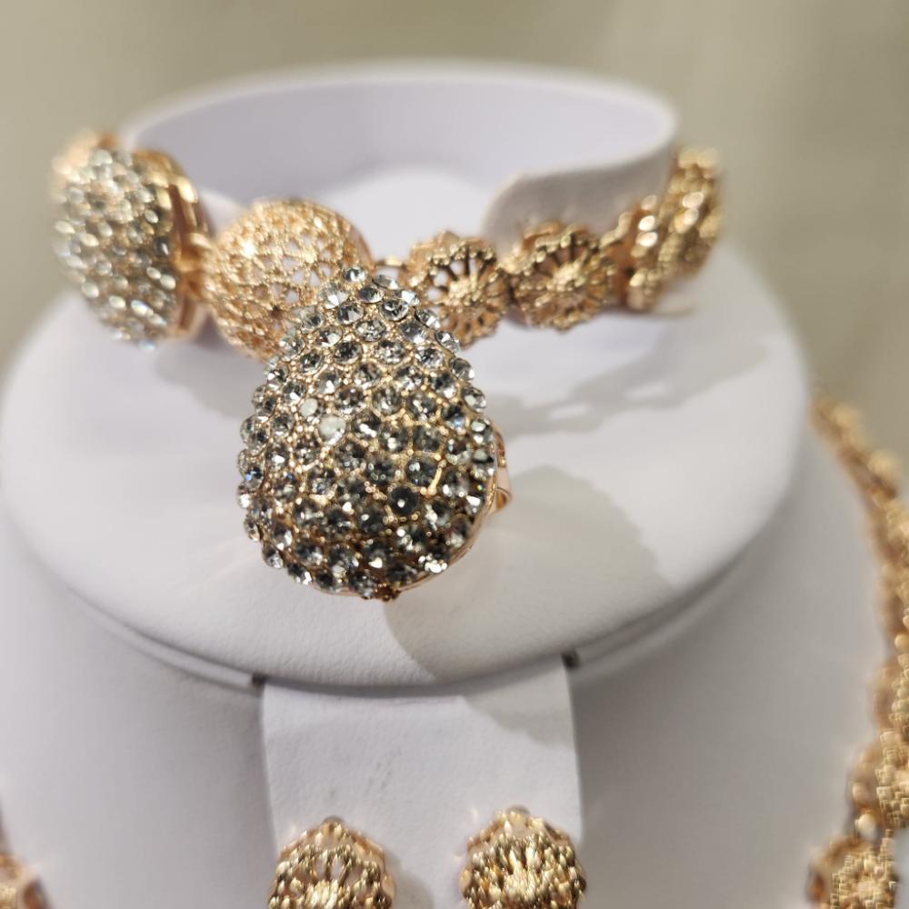 Detailed view of adjustable ring and bracelet of five piece jewelry set
