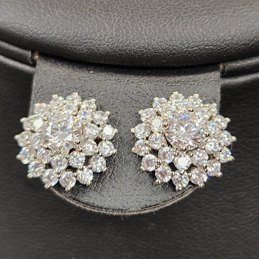 Detailed front view of stud earrings