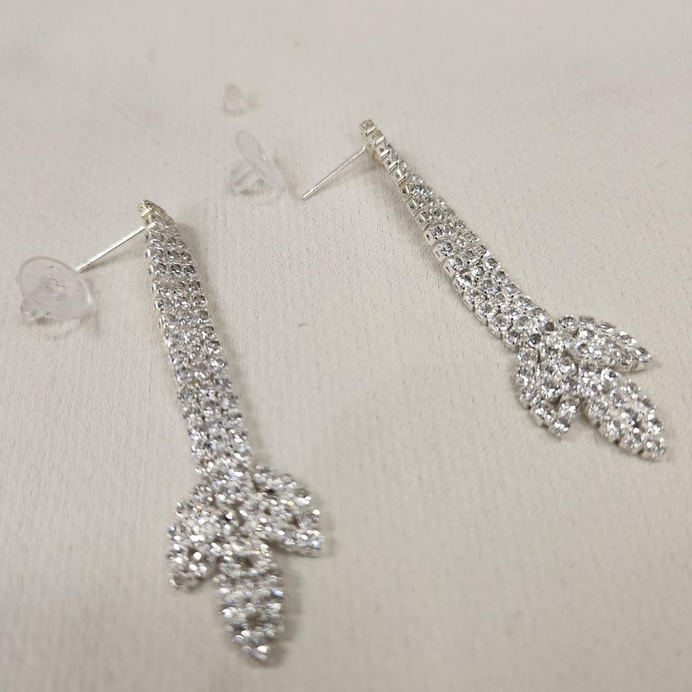 Detailed view of dangle earrings with pushback post