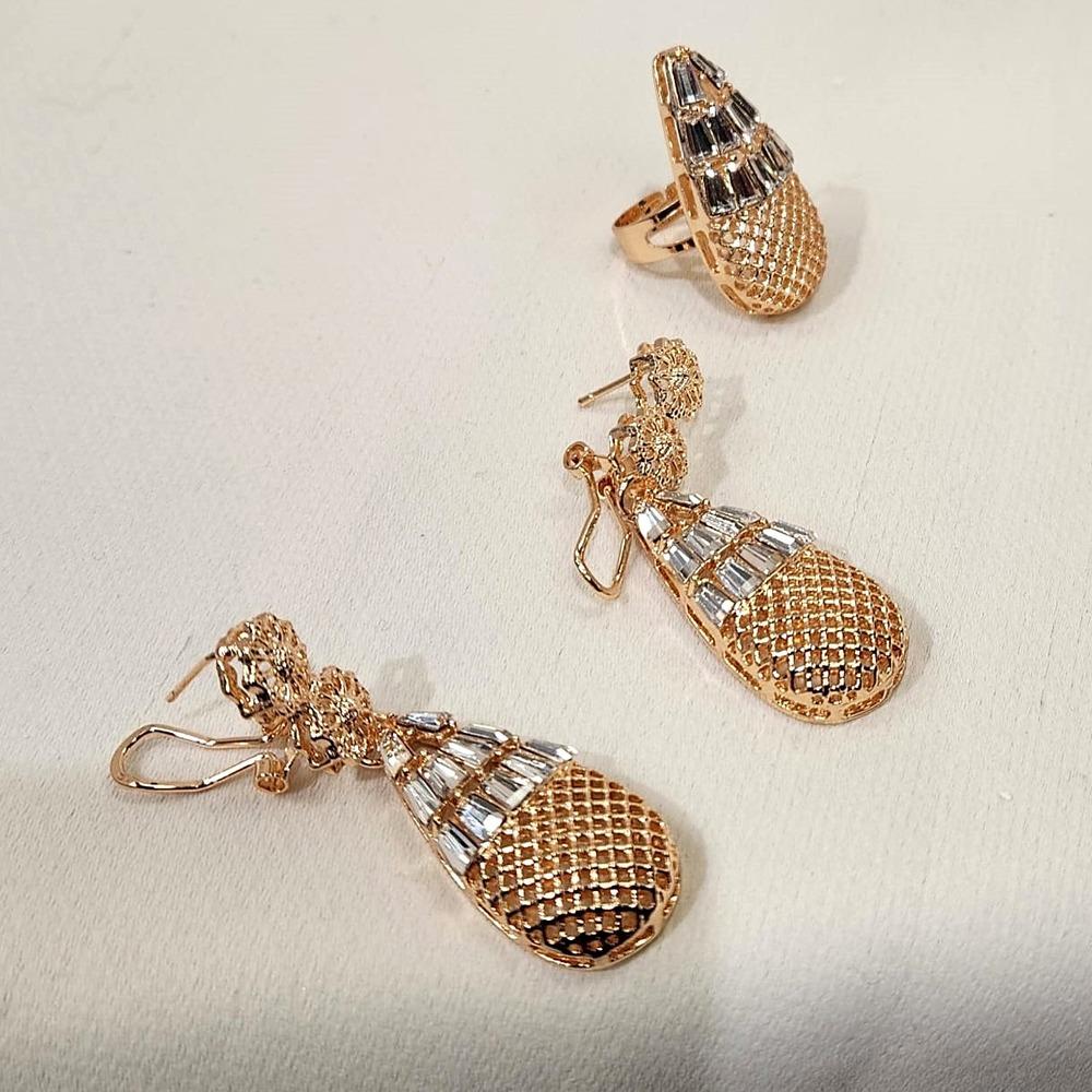 Detailed view of dangle earrings and adjustable ring