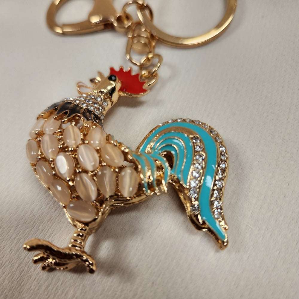Detailed view of colorful rooster shaped purse charm