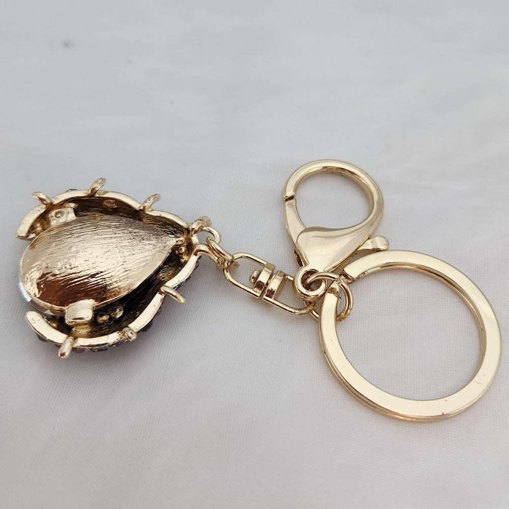 Beatle shaped stone studded purse charm when reversed