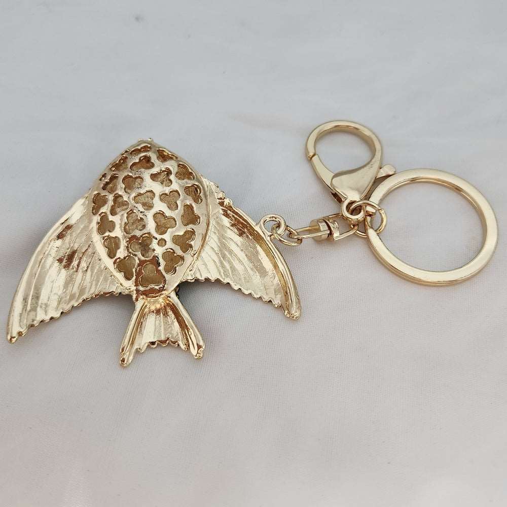 Colorful stone studded fish shaped purse charm when reversed