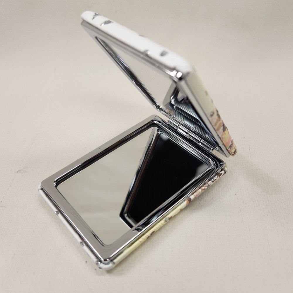 Beautiful pocket mirror in dreamy butterfly pattern when opened