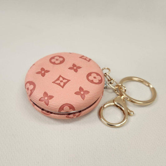Peach Pocket mirror with engraved floral pattern and a keyring when closed