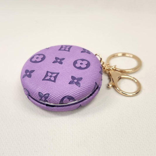 Lilac Pocket mirror with engraved floral pattern and a keyring when closed