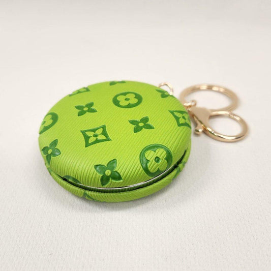 Green Pocket mirror with engraved floral pattern and a keyring when closed
