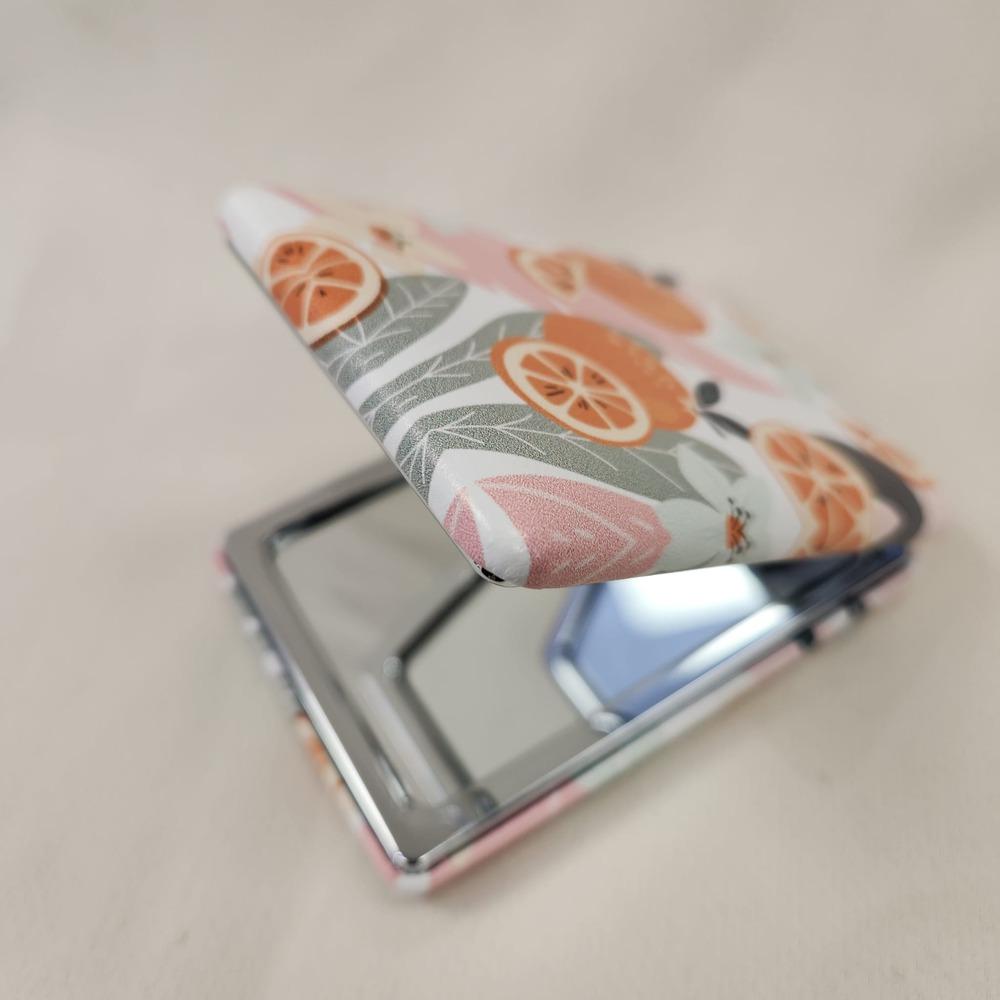 Lovely orange print pocket mirror when opened