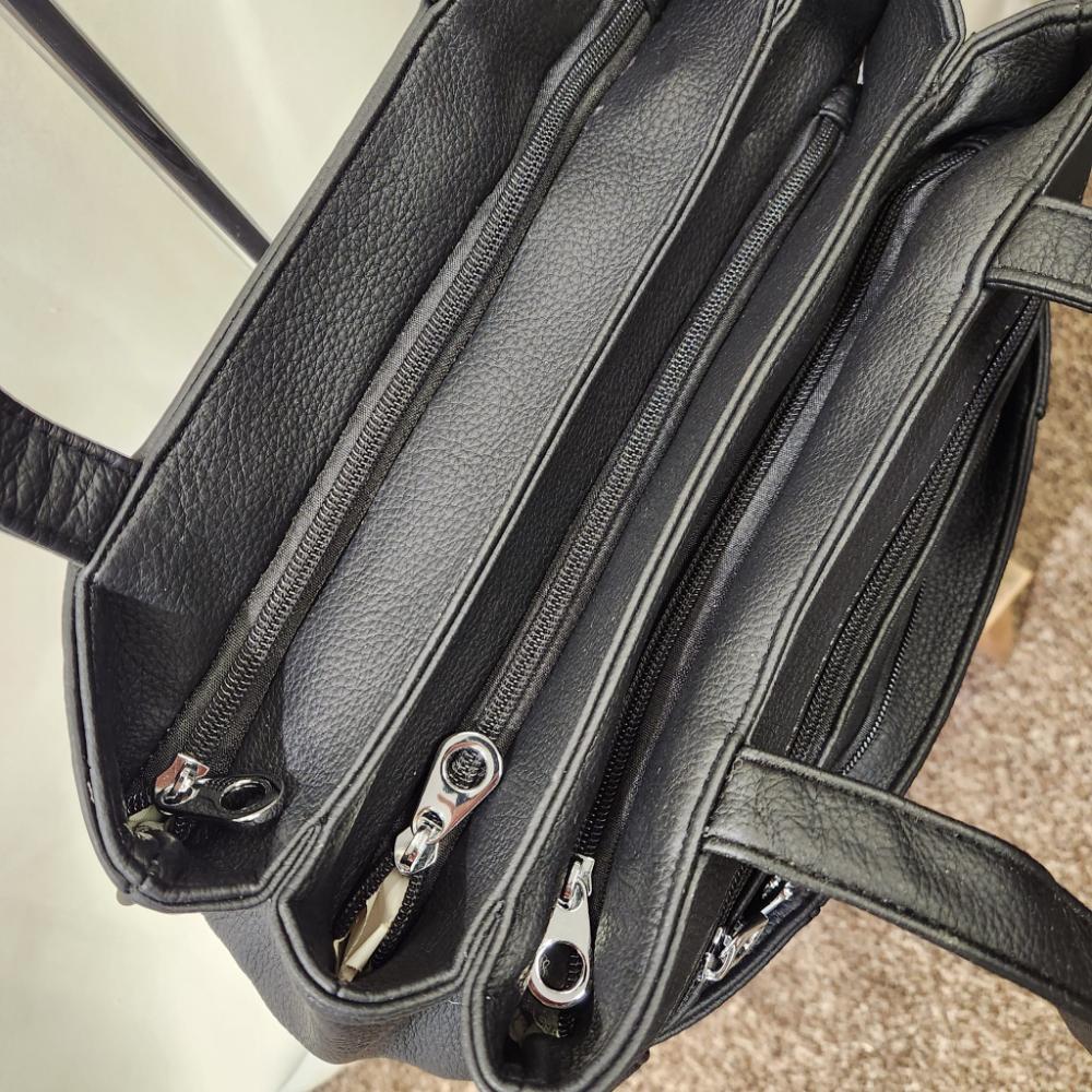 Top view of Multi compartment black handbag for women