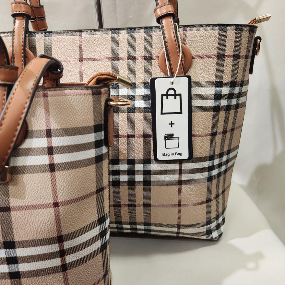 Tag on the bag in a bag set with tan handles