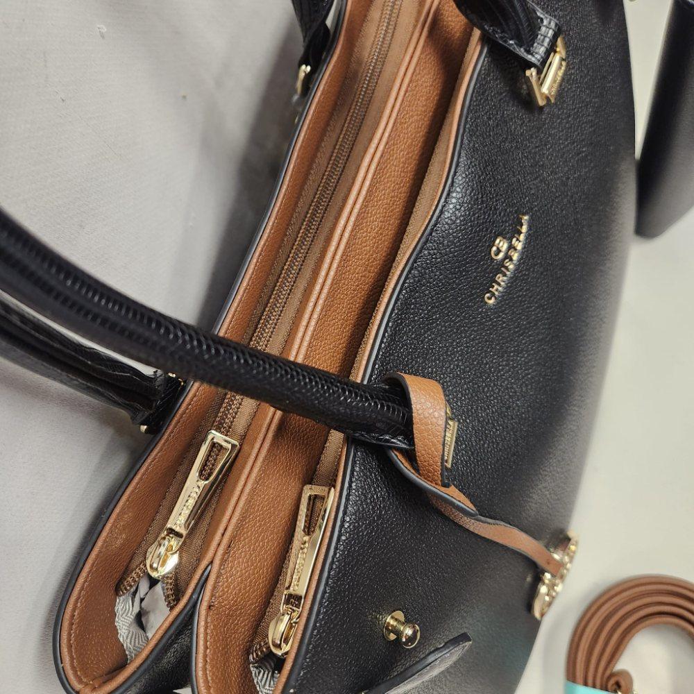 Top view of Black handbag with tan and grey accent colors