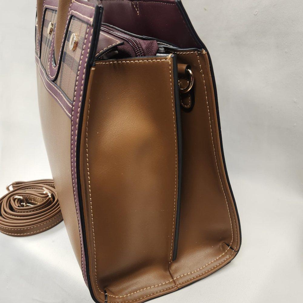 Another side view of Coffee color handbag with burgundy trim