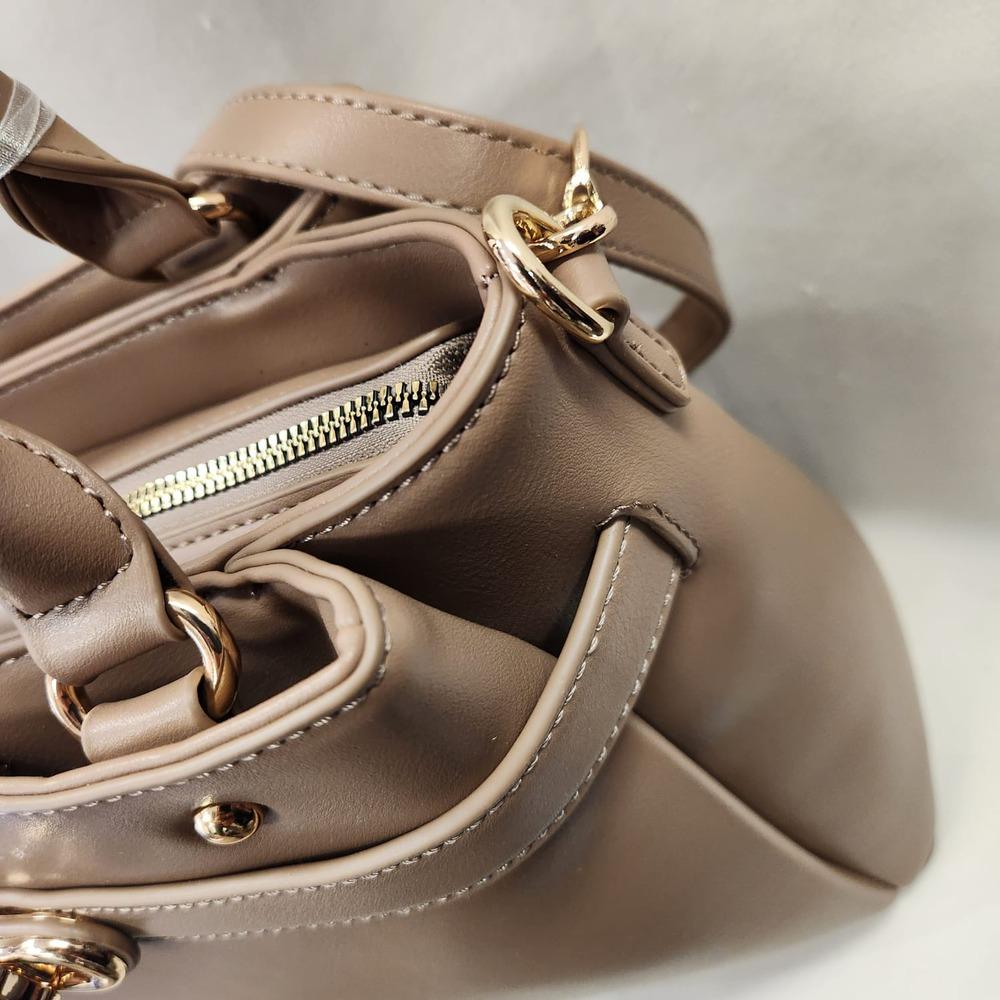 Side view of taupe handbag