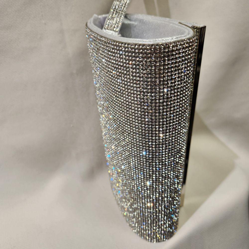 Rear side of stone studded silver frame party purse