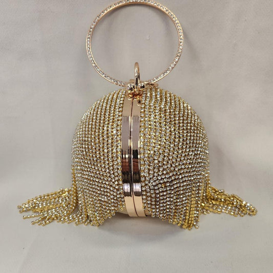 Gold globe shaped party purse with clear stone tassels