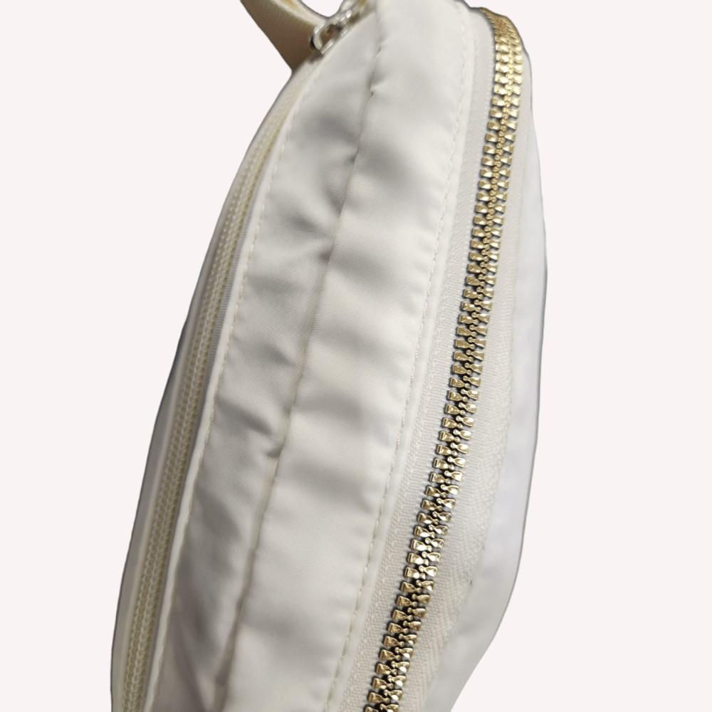 Gold hardware of off white color microfiber side bag