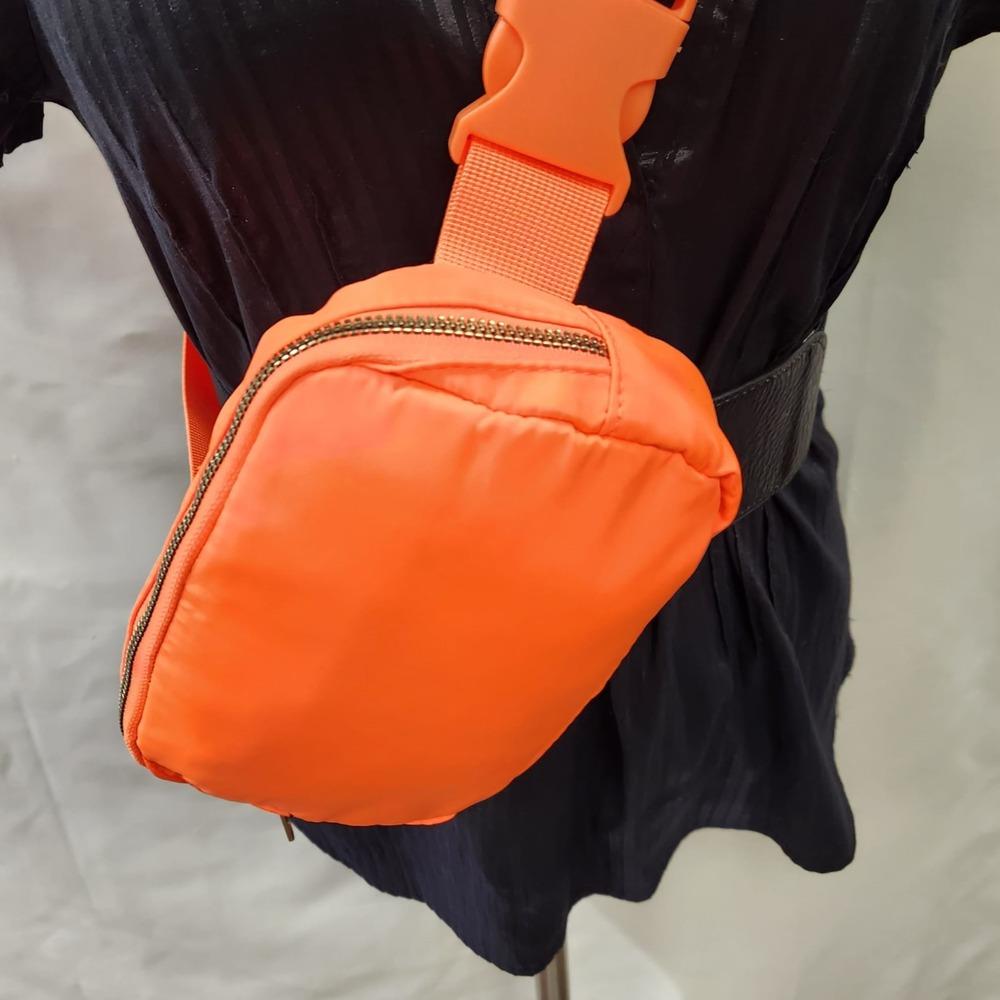 Detailed view of orange microfiber side bag
