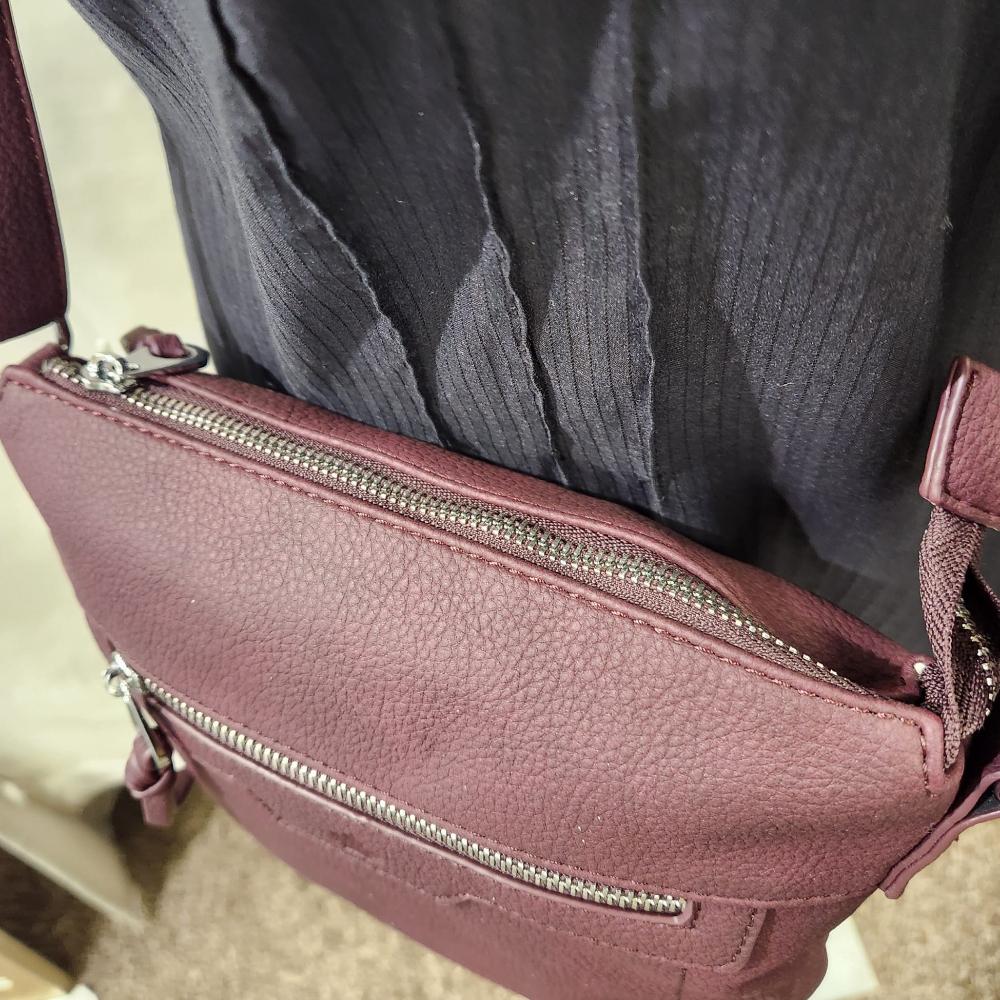 View of main zipped compartment of Vine side bag