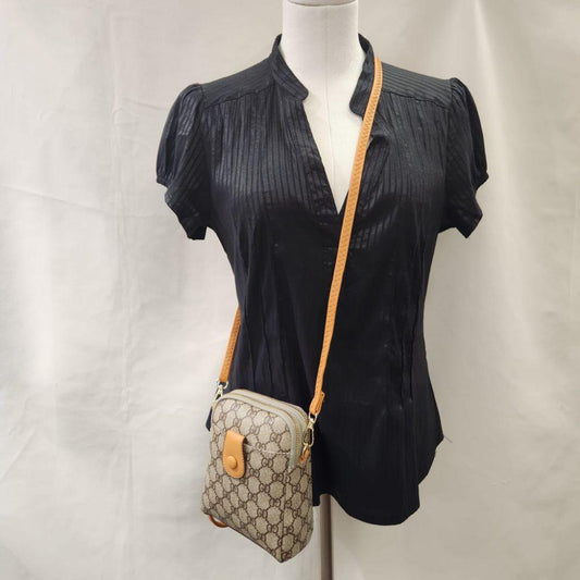 Signature print side bag in beige with brown print and tan straps