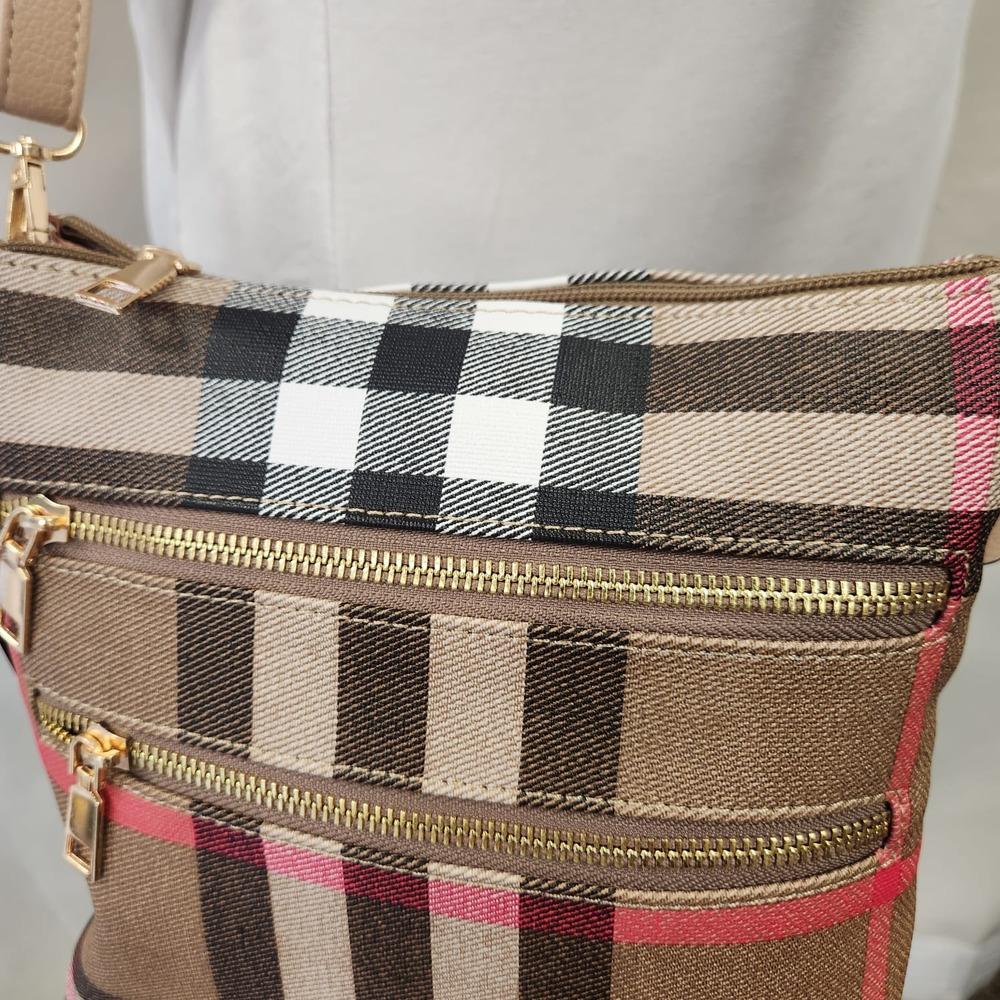 Detailed view of Plaid pattern multiple compartment side bag