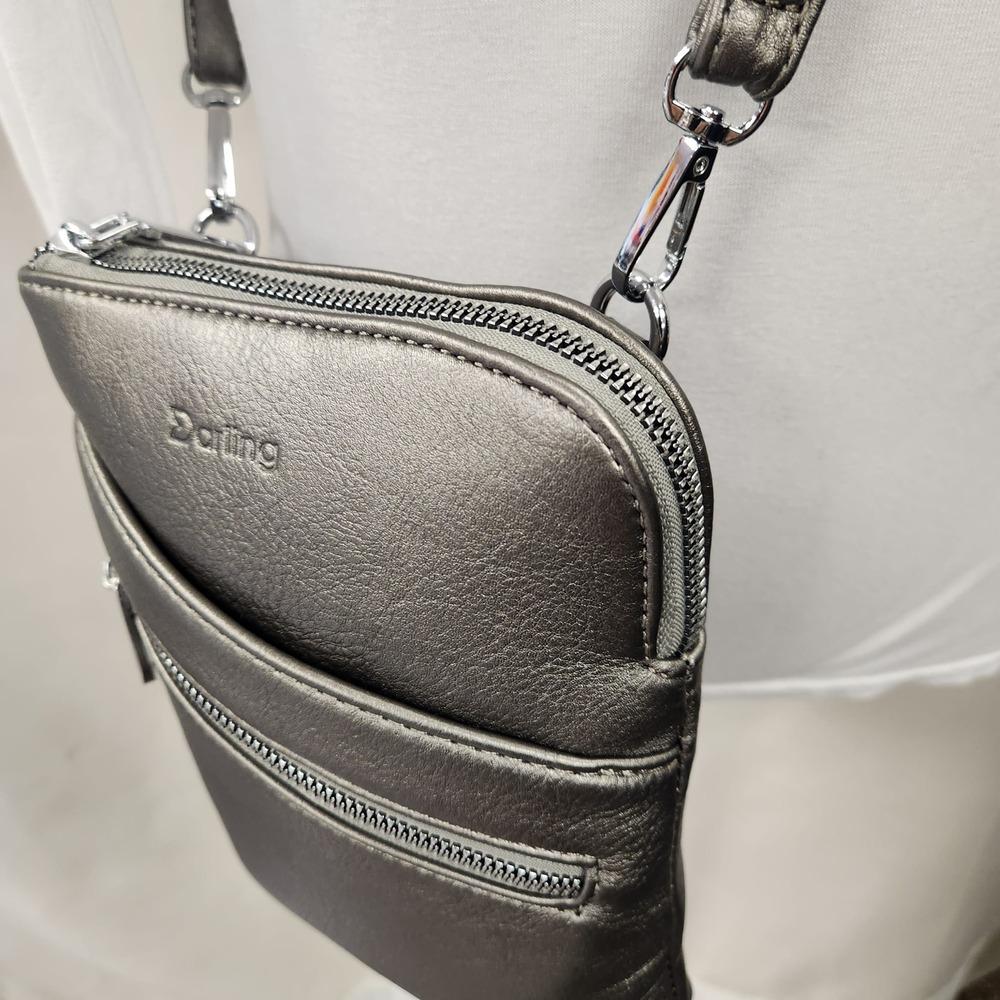 Main zipper compartment of small metallic grey side bag