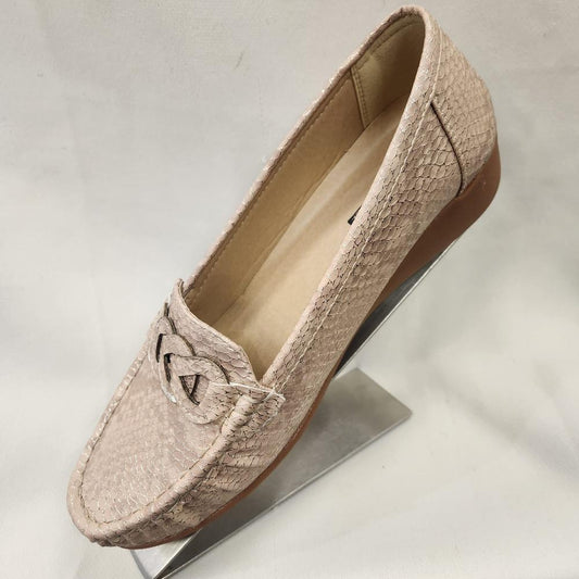 Side view of Champagne color textured flat shoes for women