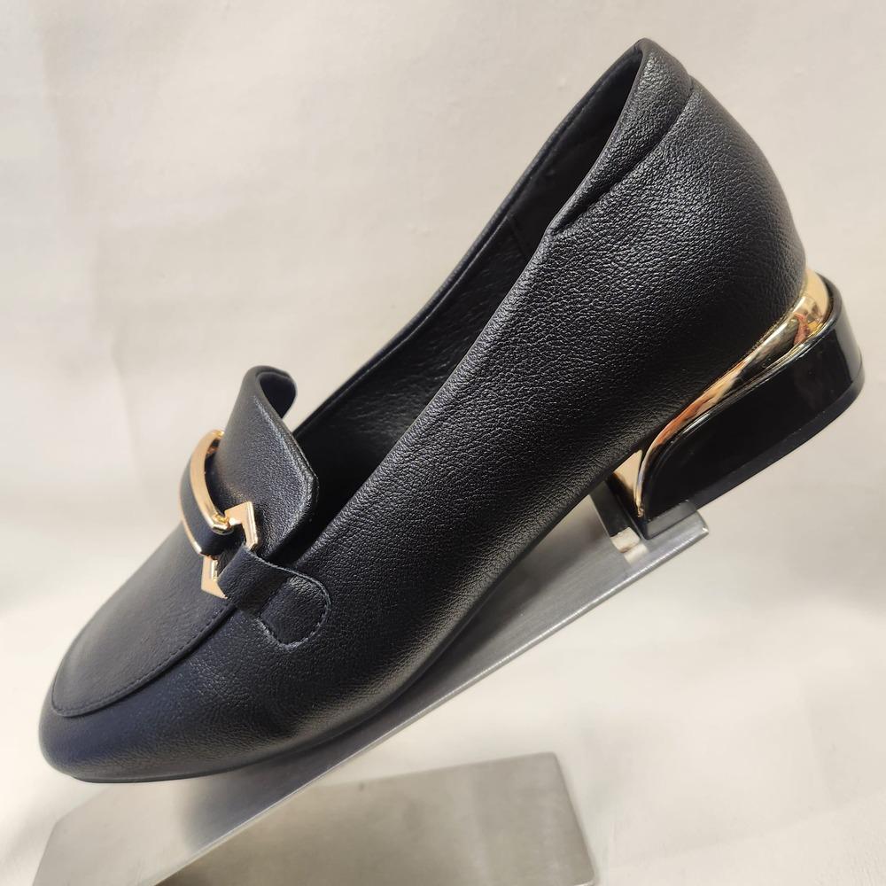 Side view of Fancy black flat shoes for women with gold trim